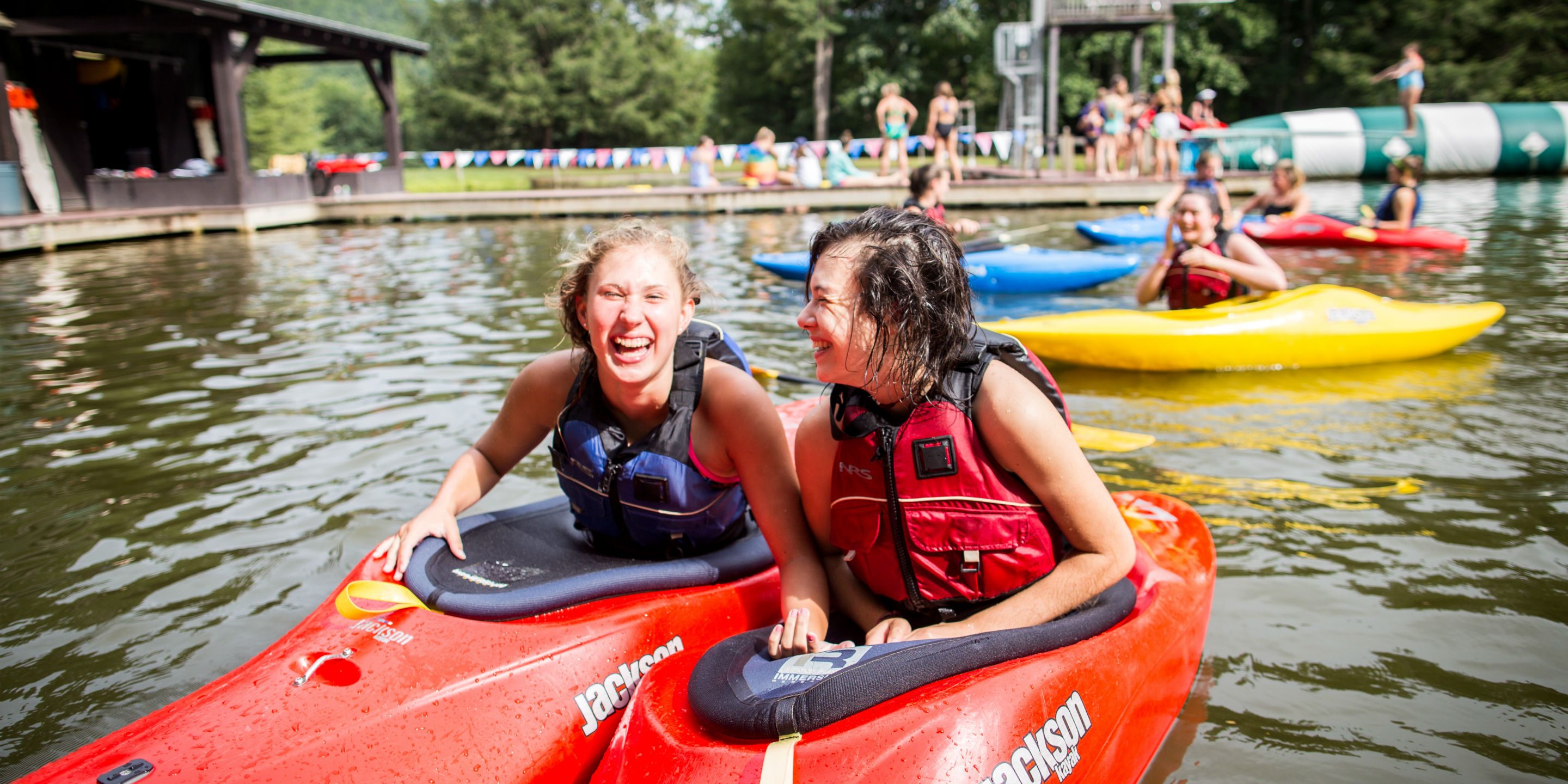 Girls laughing in kayaks