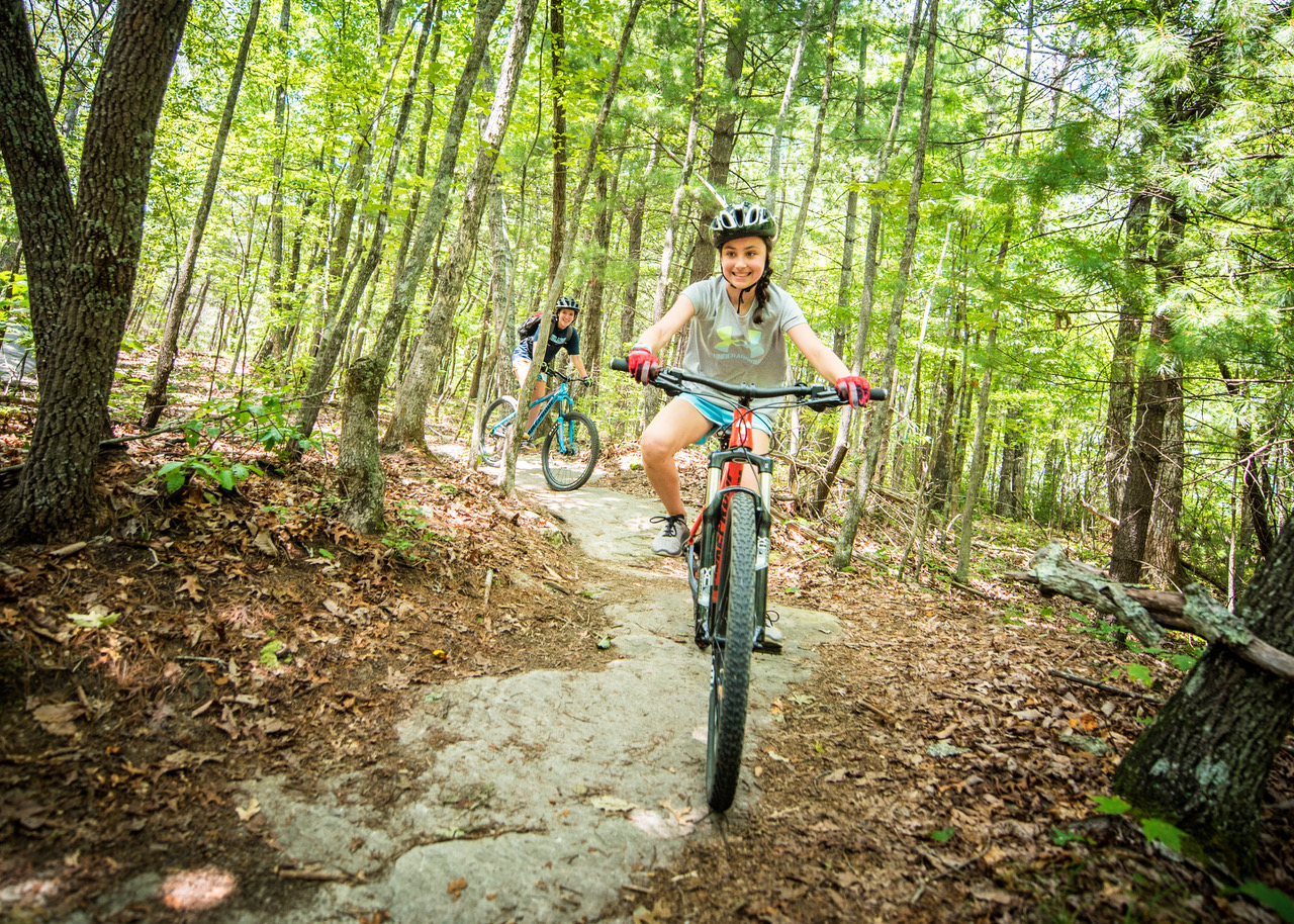 Girls on a trail riding bikes